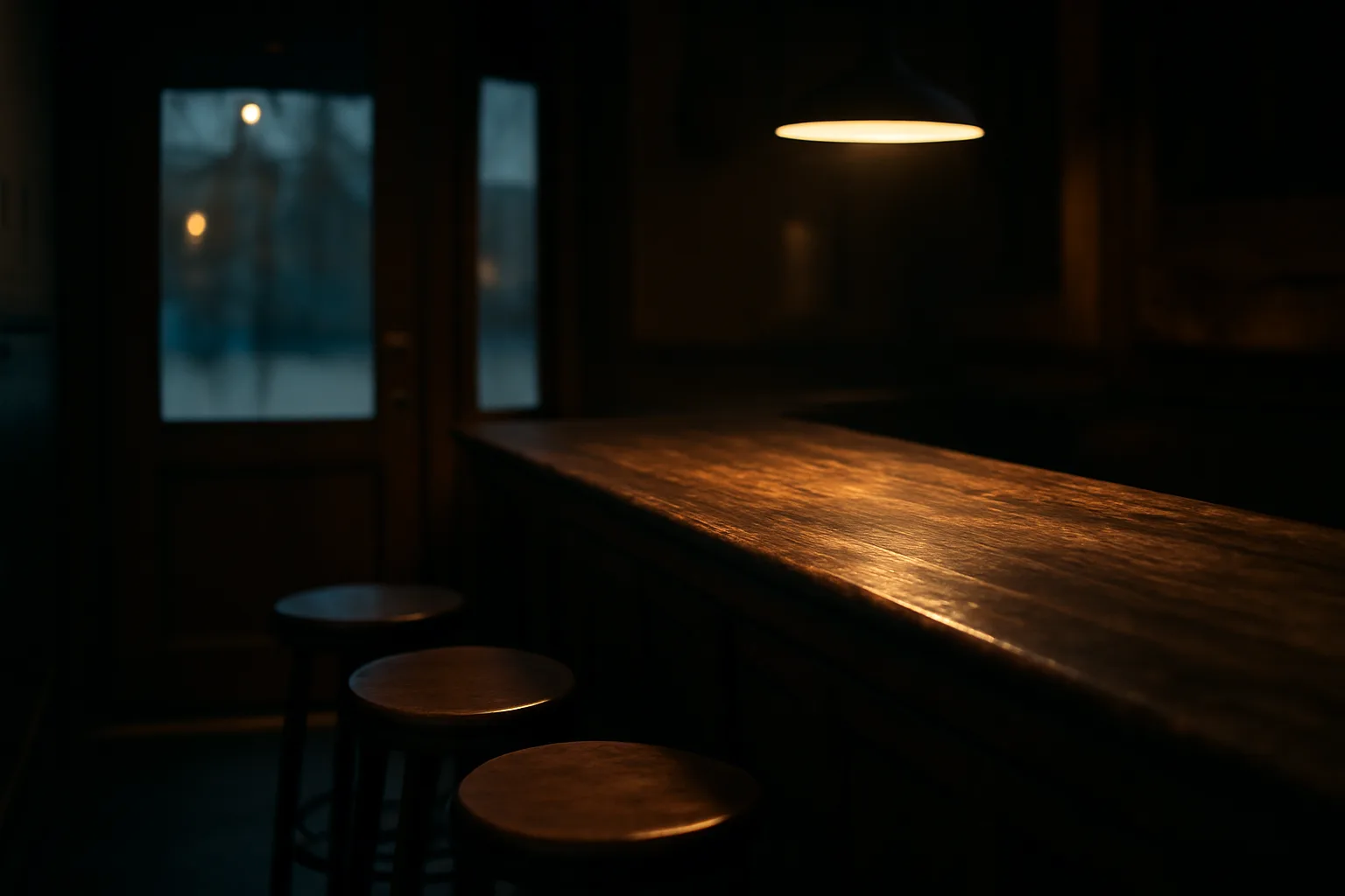 Empty bar counter at dusk symbolizing liquor license application and eligibility questions
